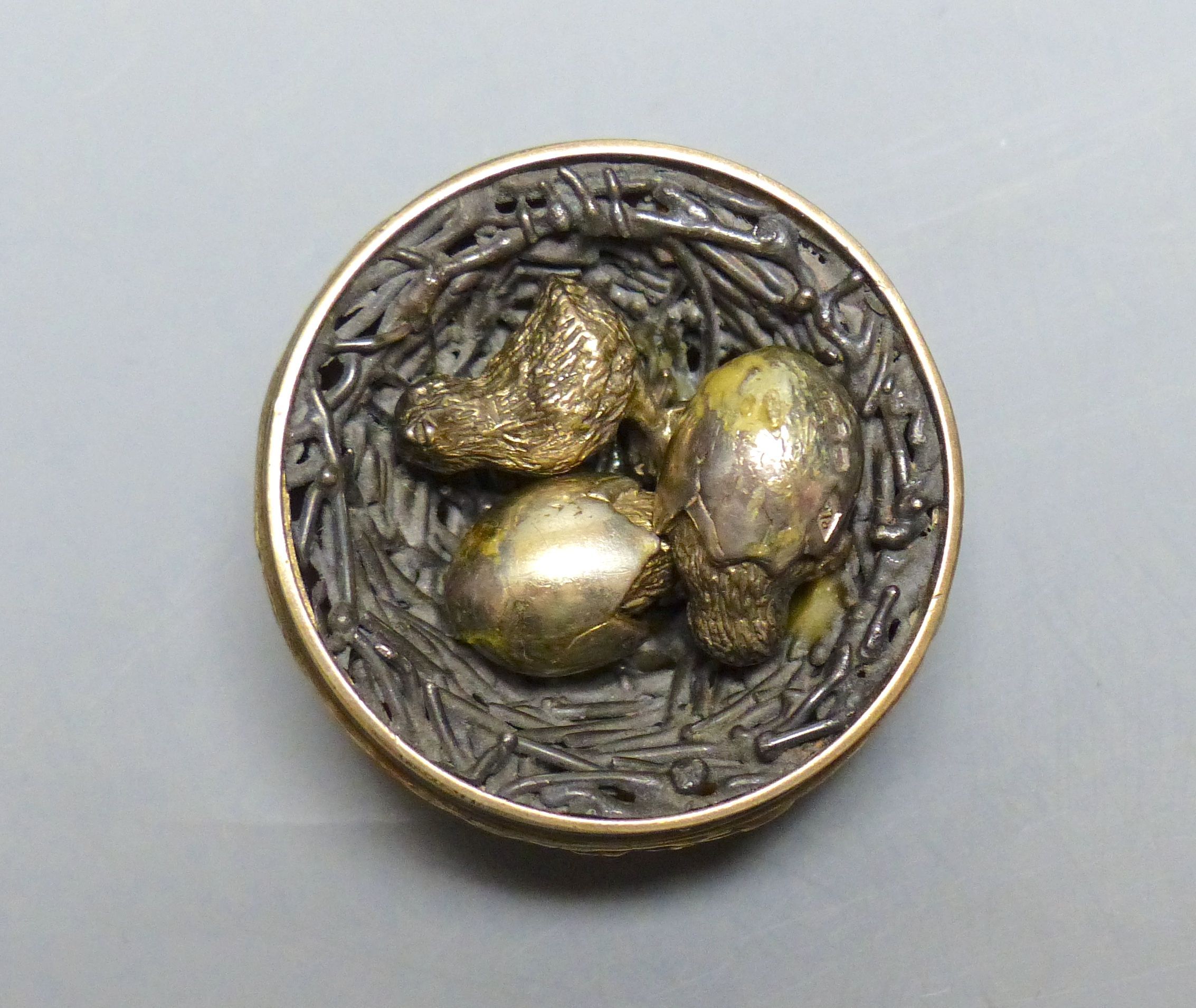 A modern silver gilt surprise egg, by Richard Lawrence Geere, London, 1975, on stand & a model of a fighting cock.